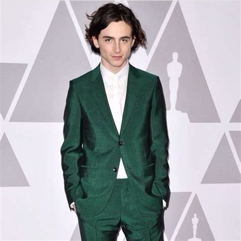 green gucci suit.